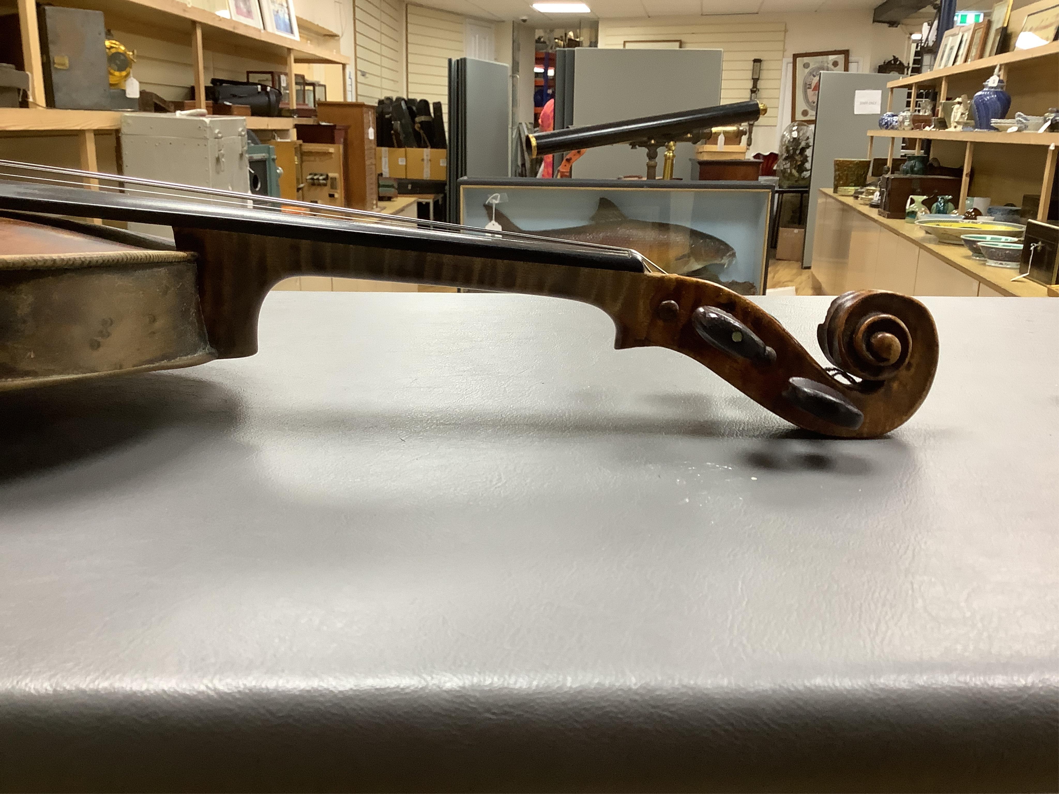 An interesting late 18th century violin, with one piece bird’s eye maple back, unsigned, with two silver fully mounted octagonal bows, one stamped Voight CITES Submission reference, 3XFNUBT7 and Submission reference, RHL